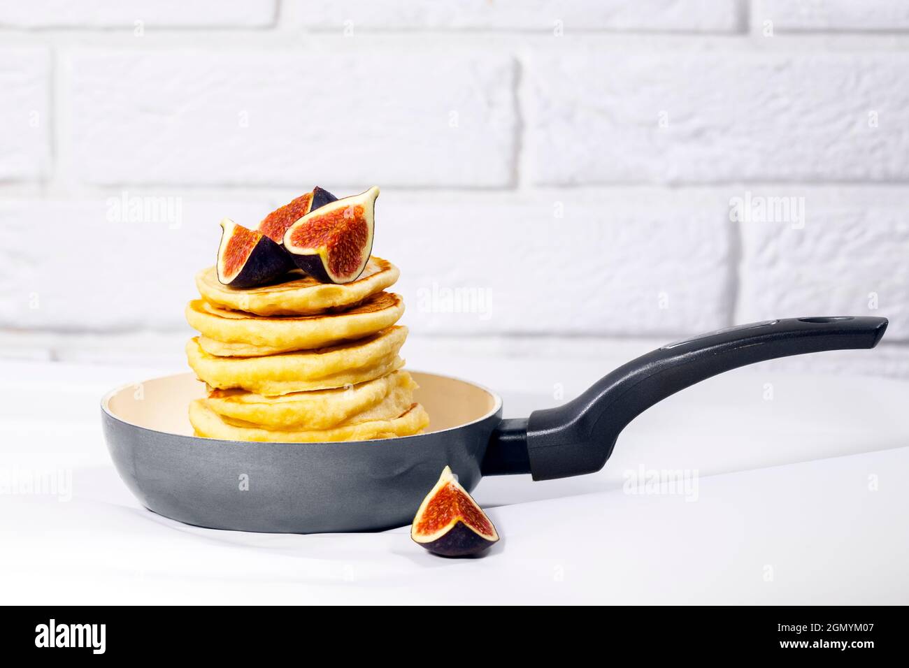 Pancakes with Fig in pan on white background, Healthy Eating Concept, Traditional American Breakfast Stock Photo
