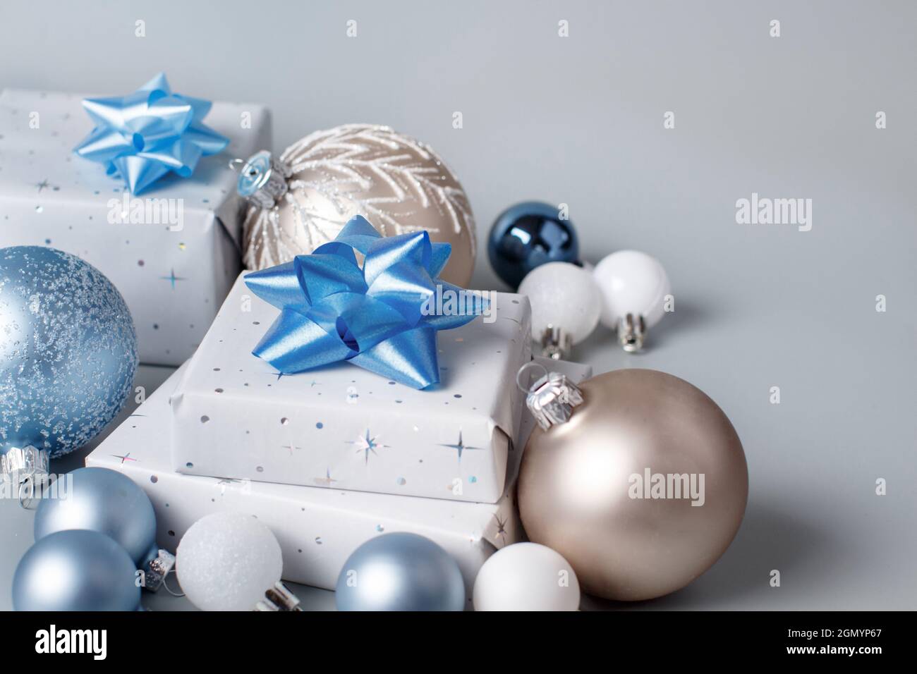 Christmas present with blue bow and silver decorations closeup Stock Photo  by katrinshine