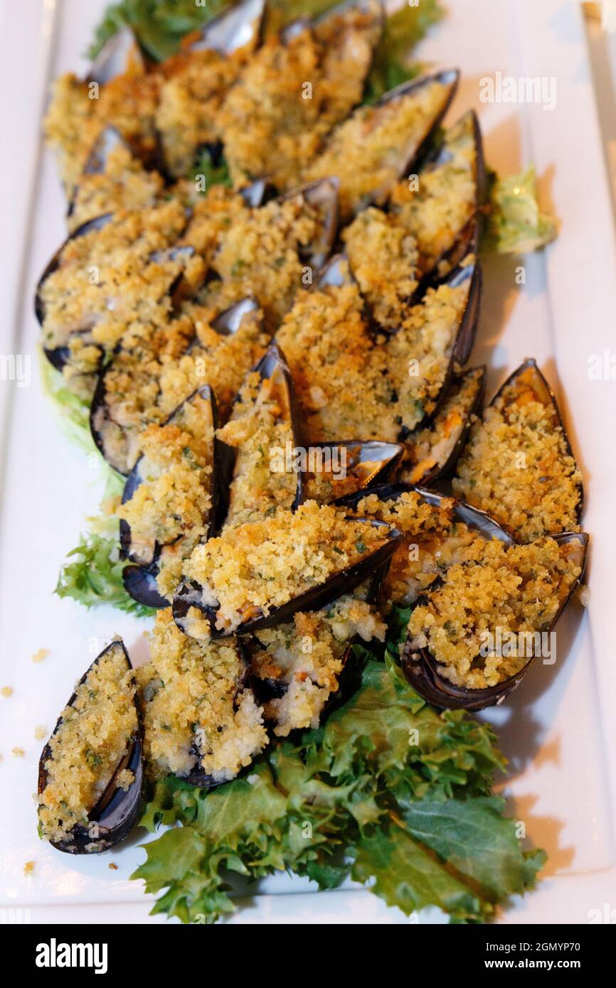 Traditional Apulean antipasti Mussels au gratin during Italian wedding ...