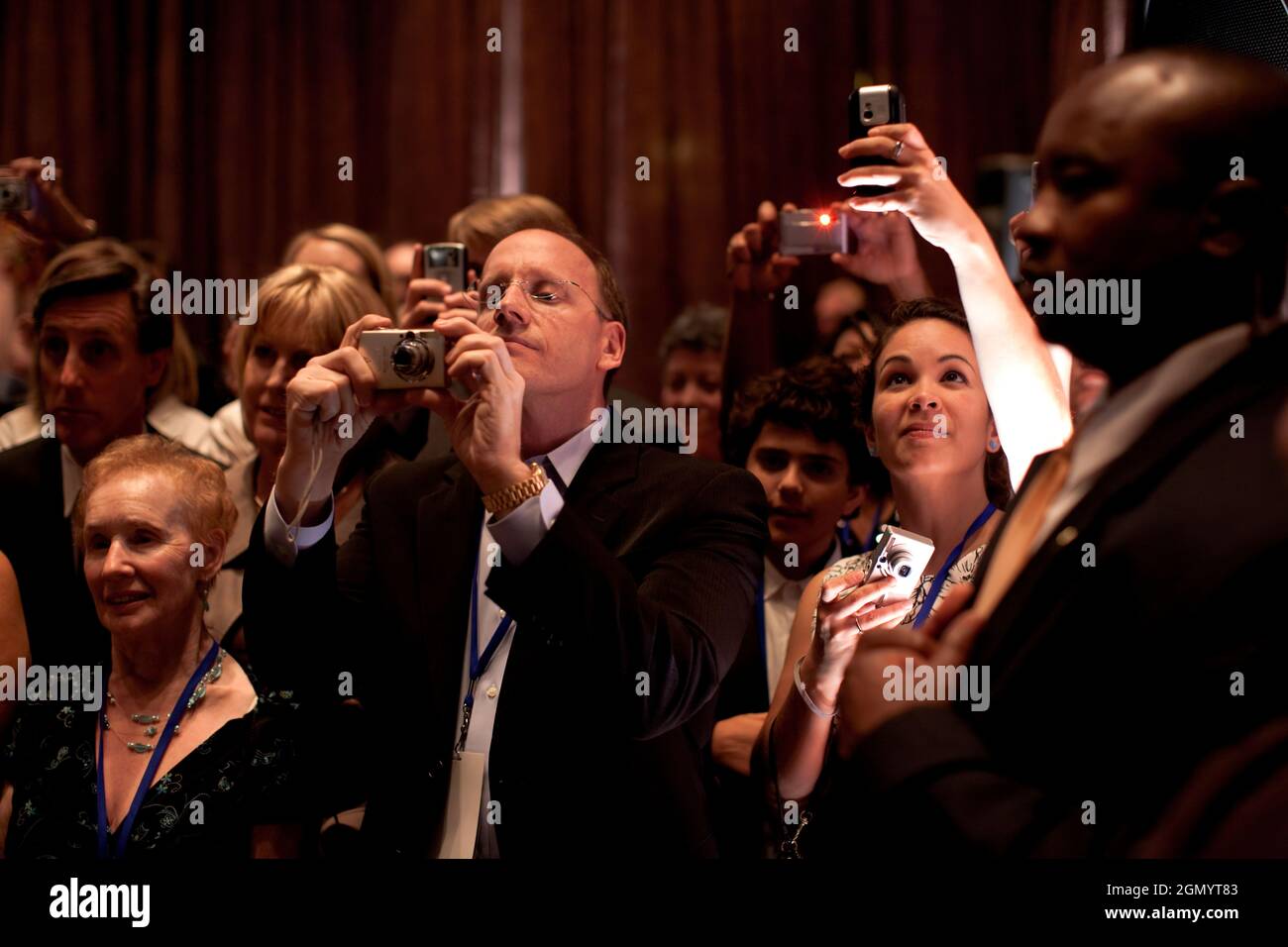 Onlookers seize the opportunity to take photographs of President Barack Obama in Las Vegas during a fundraiser for Sen. Harry Reid at Caesar's Palace, May 26, 2009. (Official White House photo by Pete Souza) This official White House photograph is being made available for publication by news organizations and/or for personal use printing by the subject(s) of the photograph. The photograph may not be manipulated in any way or used in materials, advertisements, products, or promotions that in any way suggest approval or endorsement of the President, the First Family, or the White House. Stock Photo