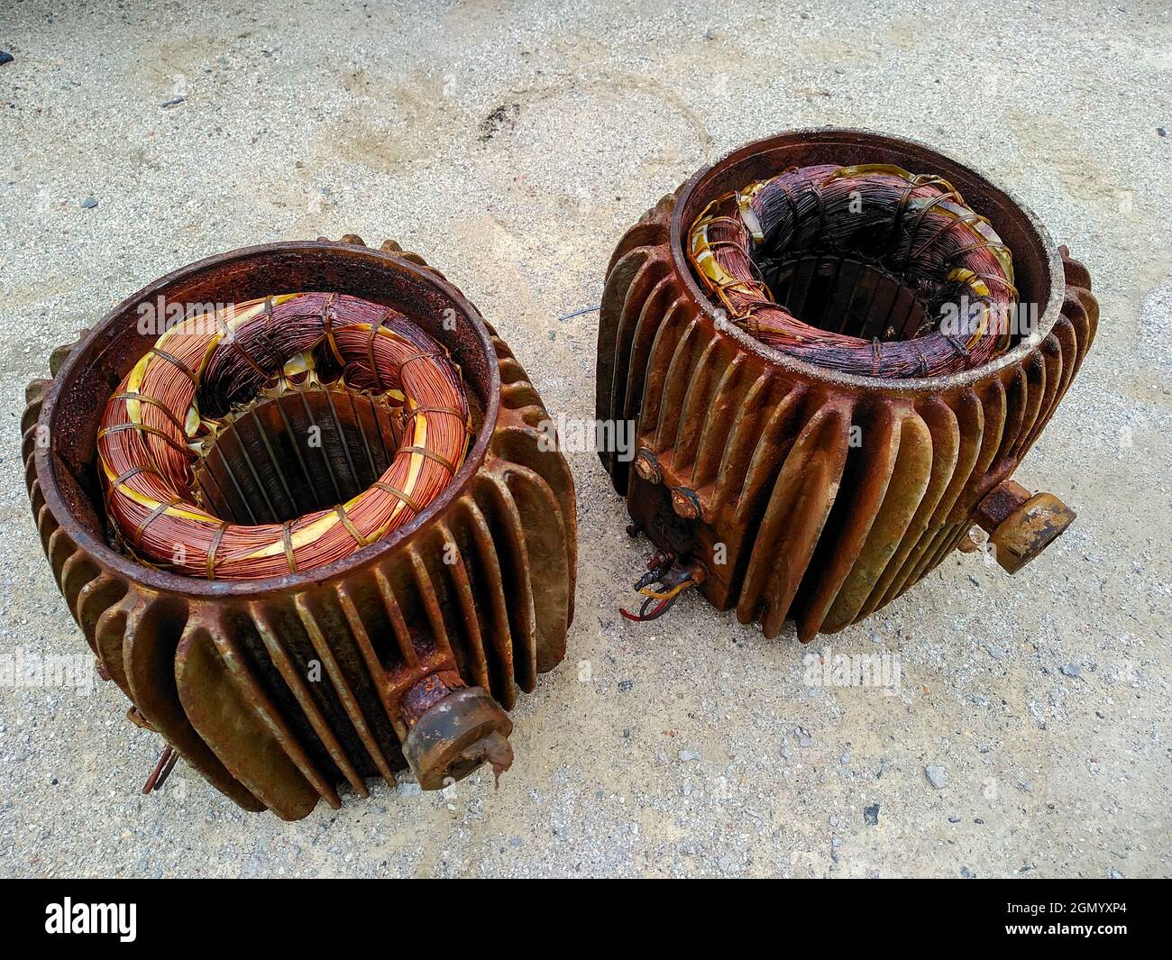 Closeup top view of two electric motors with copper wiring showing from the tops Stock Photo