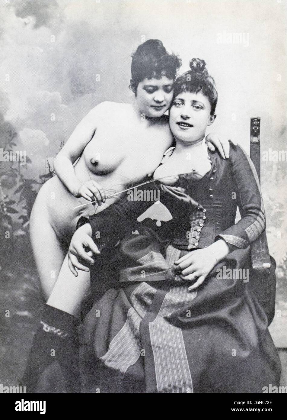 La Goulue (seated) and her sister.  La Goulue, stage name for Louise Weber, 1866 - 1929, French can-can dancer at the Moulin Rouge, who featured in Toulouse-Lautrec's portraits and posters. She was known as the Queen of Montmartre. Stock Photo