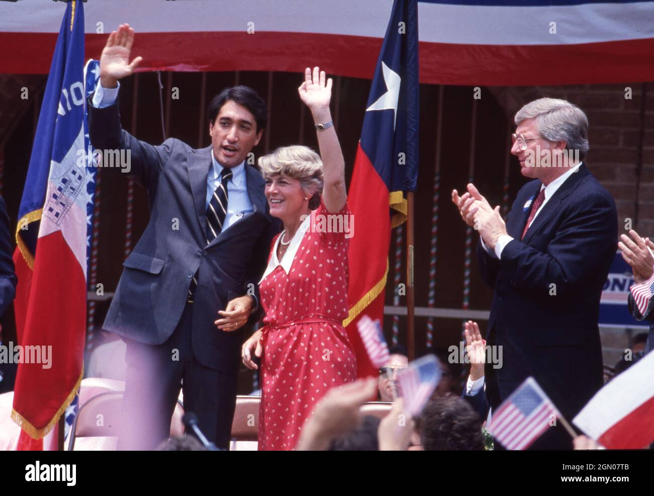 San Antonio Texas USA, 1984: Democratic vice presidential candidate Geraldine Ferraro waves to supporters during a campaign rally at Market Square. Ferraro is the first woman nominated as vice president of a major party in American politics. She is flanked by fellow Democrats Henry Cisneros, mayor of San San Antonio A(left) and Texas Gov. Mark White (right). ©Bob Daemmrich Stock Photo