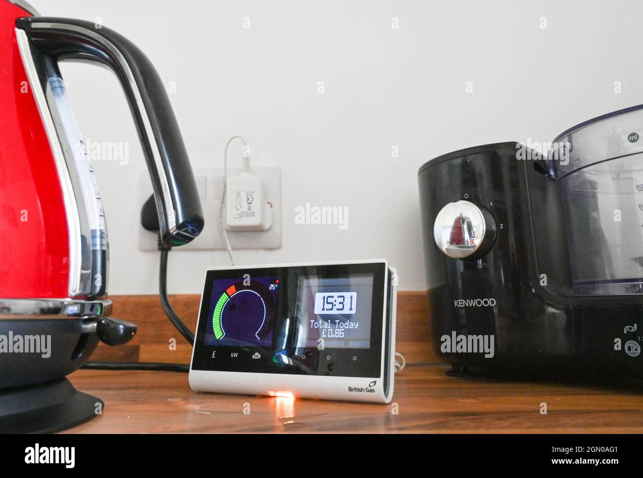 British Gas Smart Meter in UK kitchen alongside an electric kettle Stock Photo
