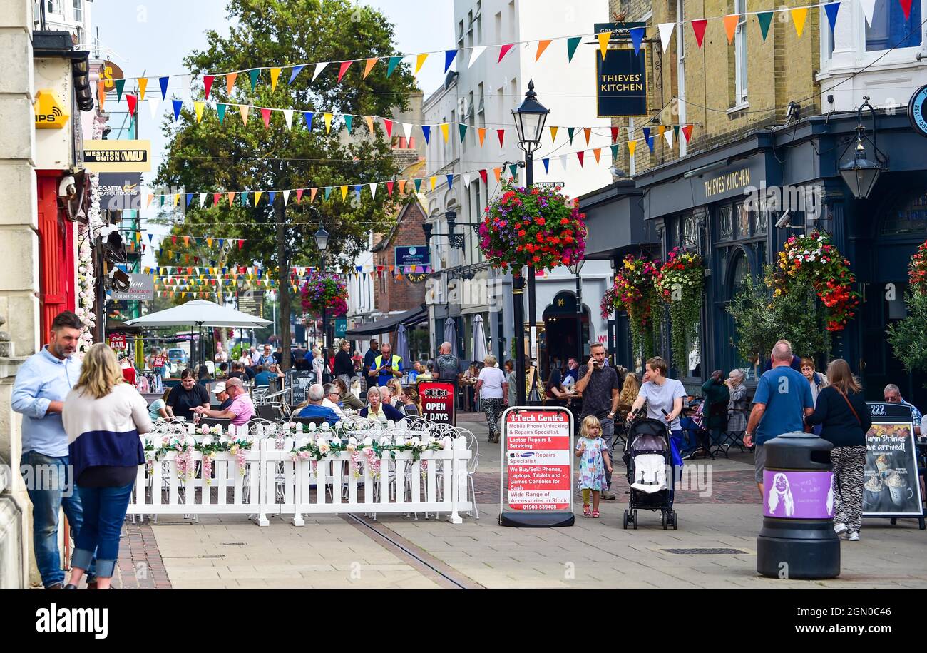 Busy Warwick Street shopping area with restaurants , pubs and cafes in Worthing , West Sussex , England , UK Stock Photo