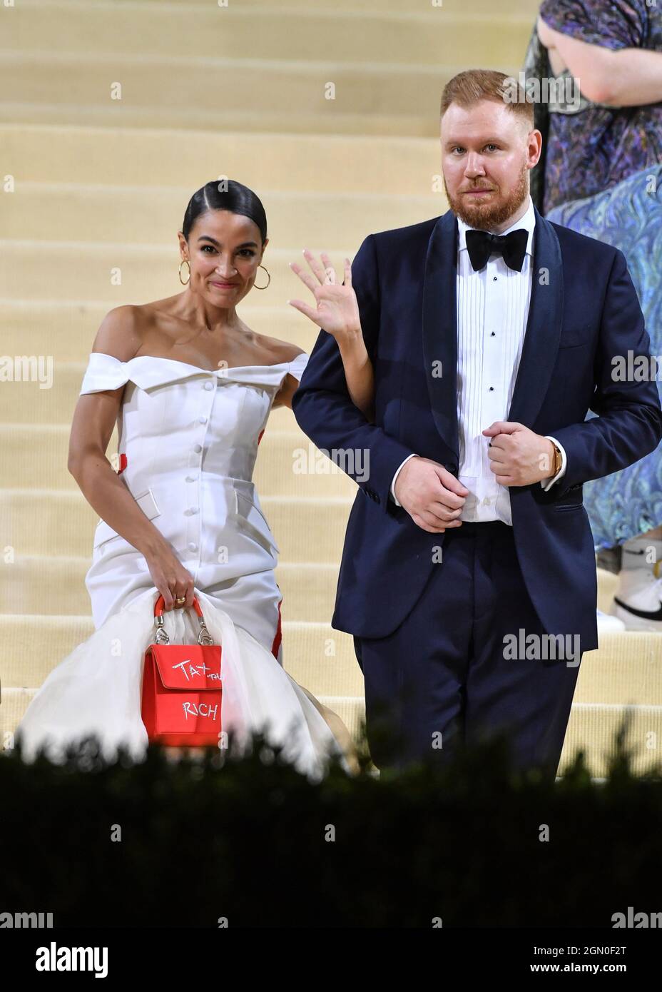 Alexandria Ocasio-Cortez and Riley Roberts attend The 2021 Met Gala Celebrating In America: A Lexicon Of Fashion at The Metropolitan Museum of Art on Stock Photo