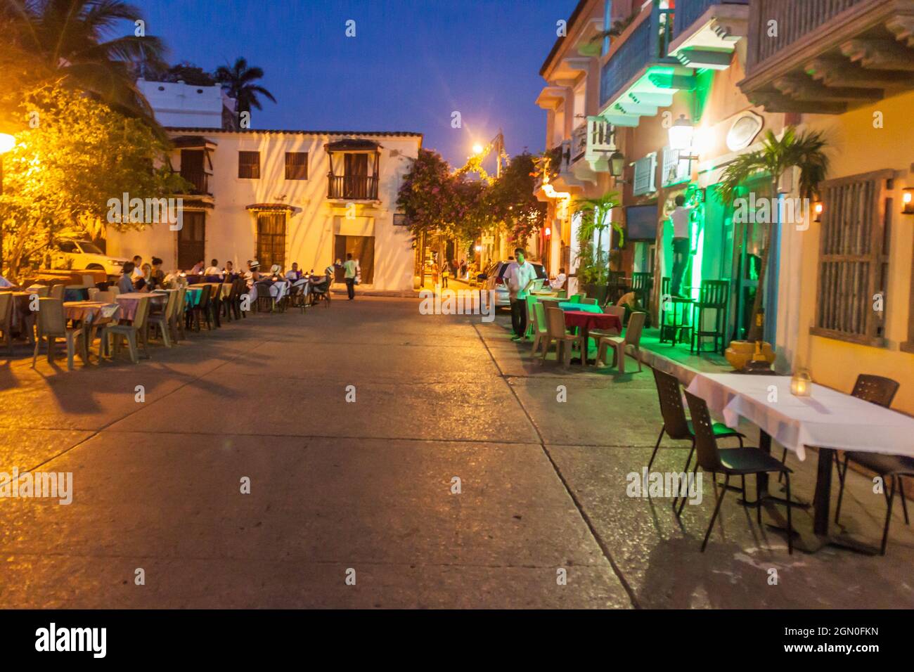 CARTAGENA DE INDIAS, COLOMBIA - AUG 29, 2015: People sit in cafes at Plaza Fernandez de Madrid square in Cartagena during the evening. Stock Photo