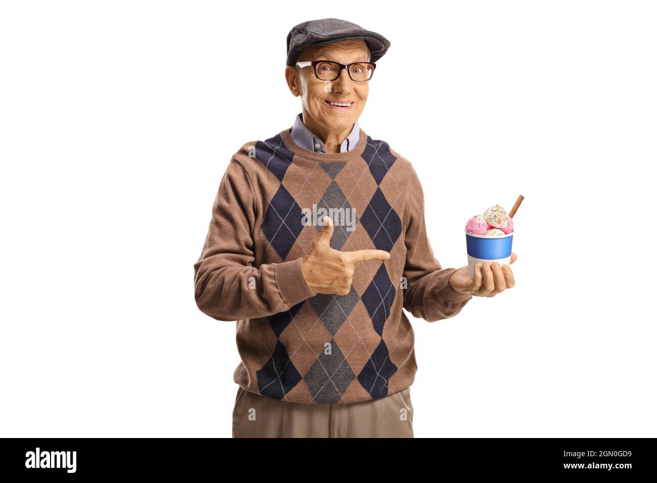 Elderly man holding ice cream in a paper cup and pointing isolated on white background Stock