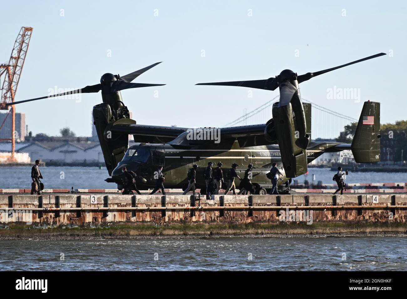 A MV-22 osprey tilt-rotor aircraft fly the President’s supporting staff and Secret Service agents as President Joe Biden arrives on Marine One to the Stock Photo