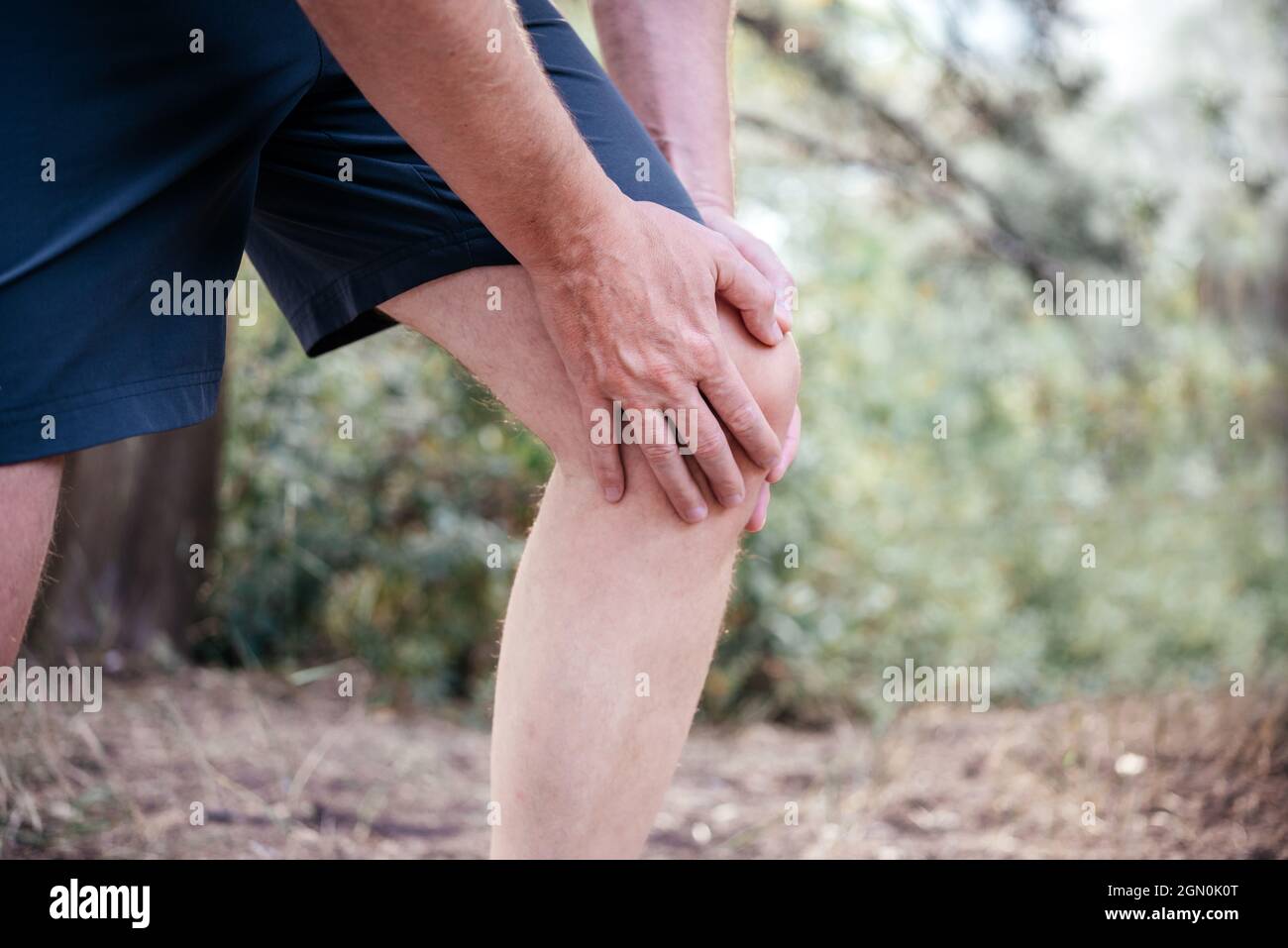 A man having difficulty in straightening or bending the knee because of