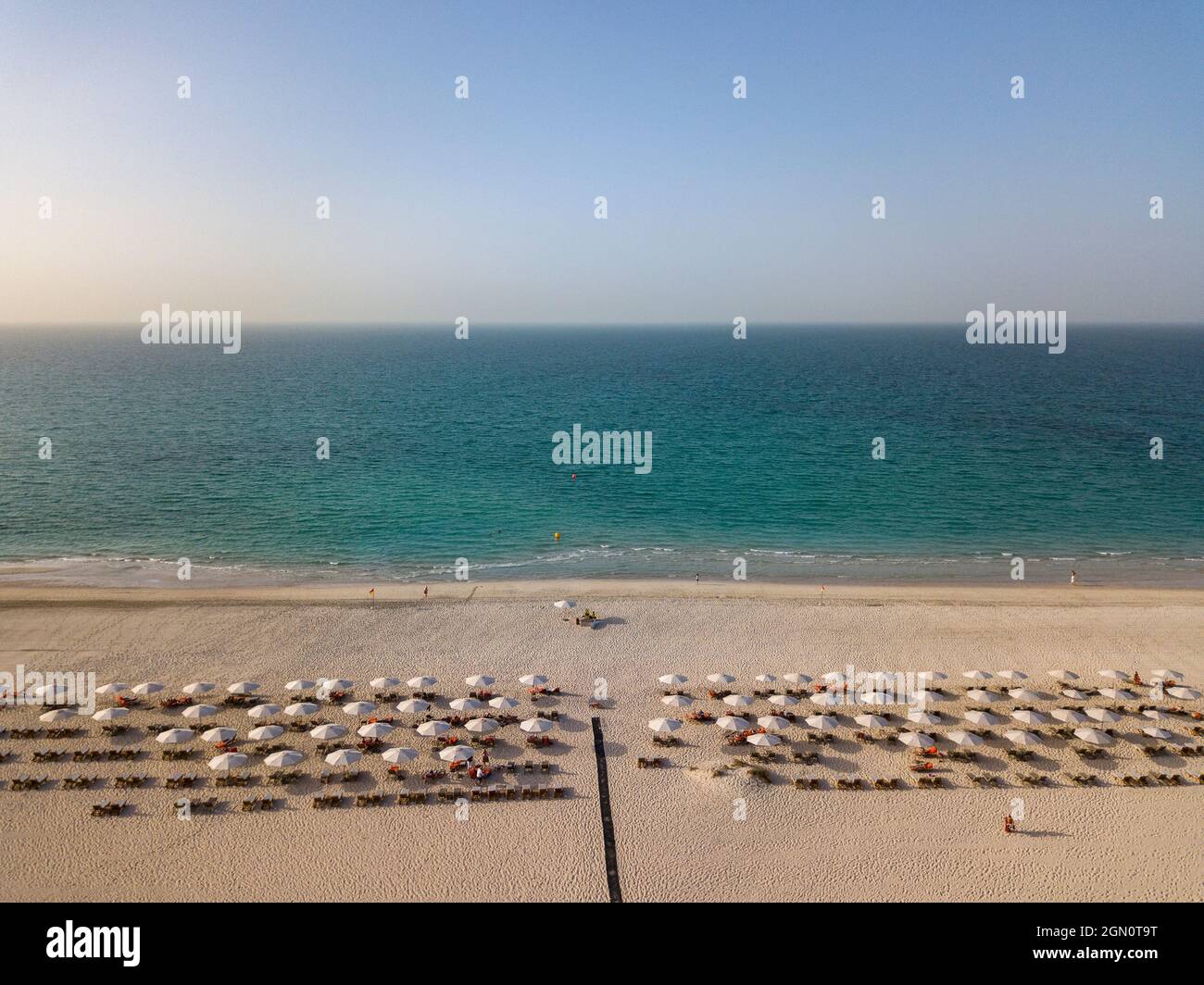 Aerial of beach chairs and umbrellas of Saadiyat Rotana Resort & Villas and sea, Saadiyat Island, Abu Dhabi, United Arab Emirates, Middle East Stock Photo