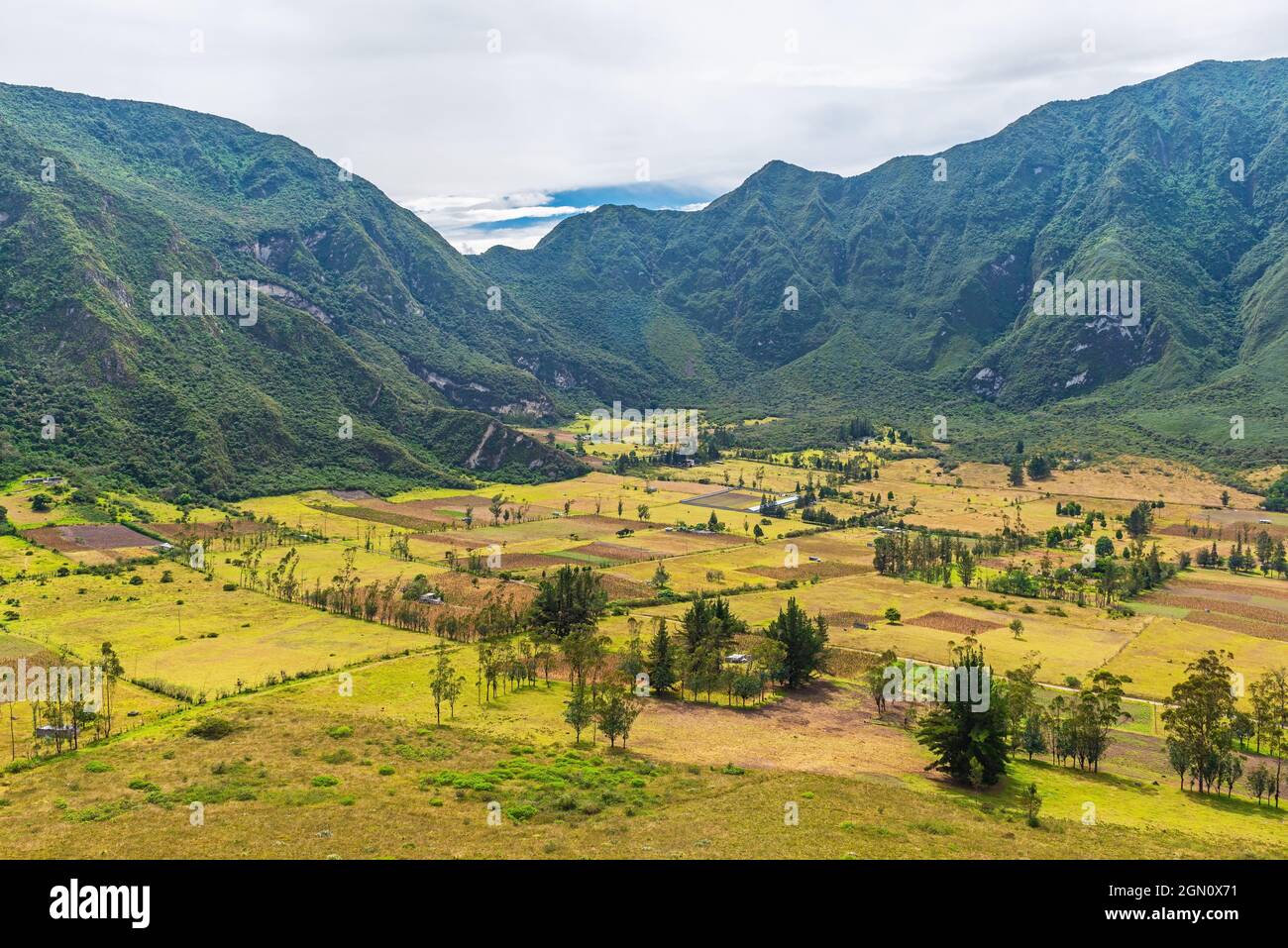 Landscape of the Pululahua volcanic crater with indigenous agriculture fields along Domo Pondona hike, Pululahua geobotanic reserve, Quito, Ecuador. Stock Photo