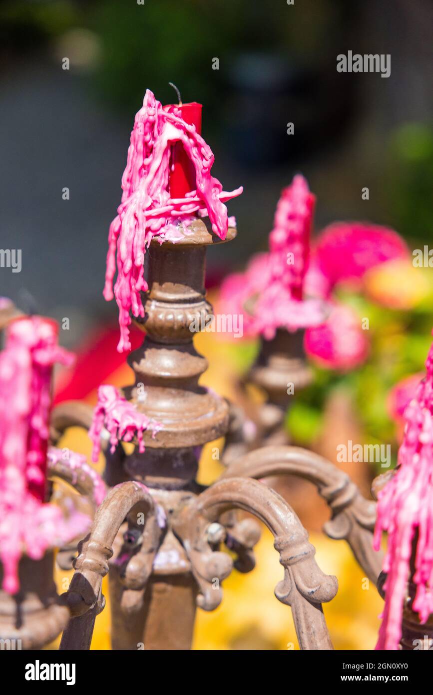 Melted candlesticks on a vintage candle holder Stock Photo Alamy