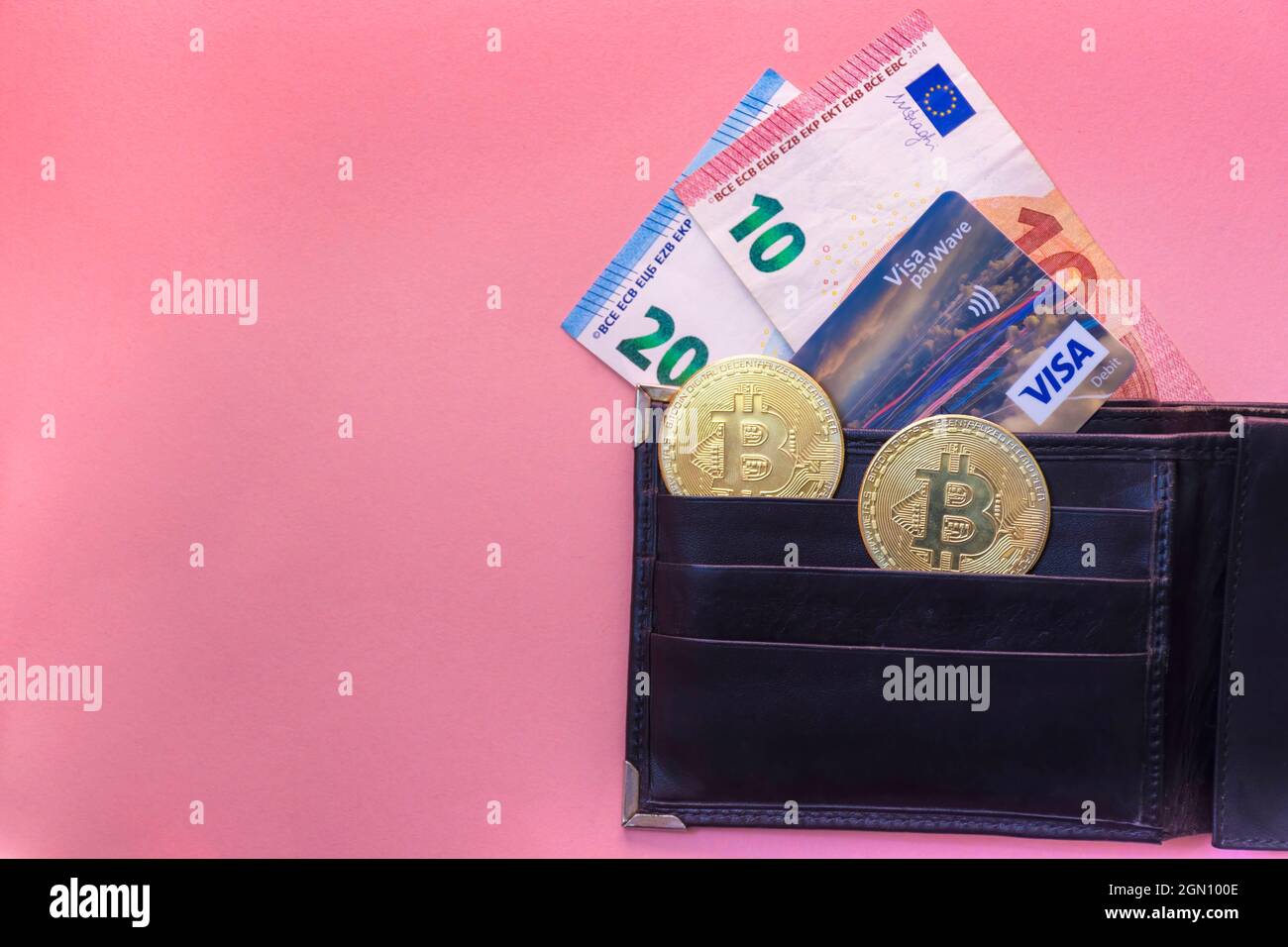 Graz, Austria-May 11, 2021: Black leather wallet with Euro currency, Visa  credit card and Bitcoin BTC crypto gold coins, new virtual money concept  Stock Photo - Alamy