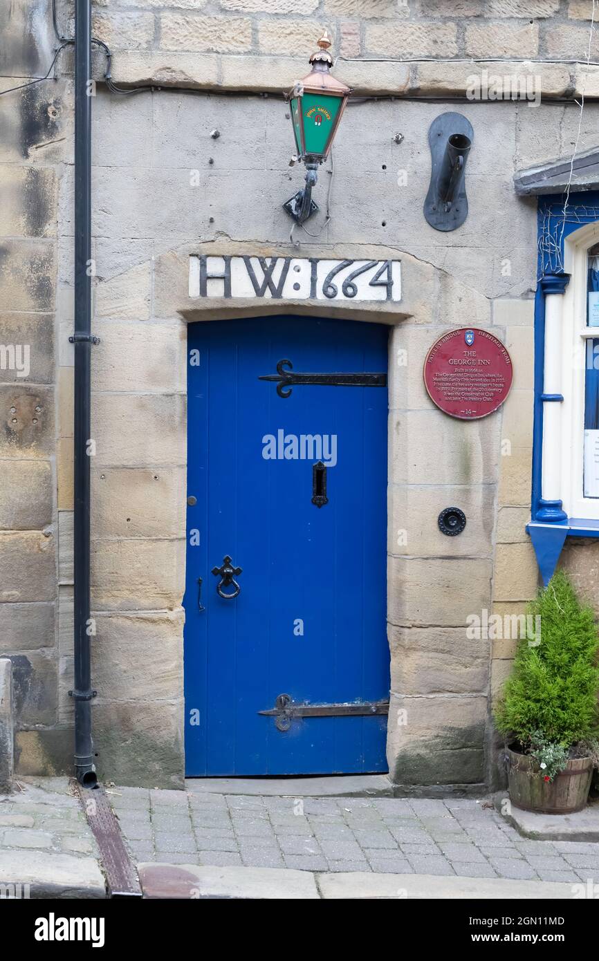 Pateley Bridge North Yorkshire. The Blue door of The Pateley Club. Formally the George and Dragon Inn. Stock Photo
