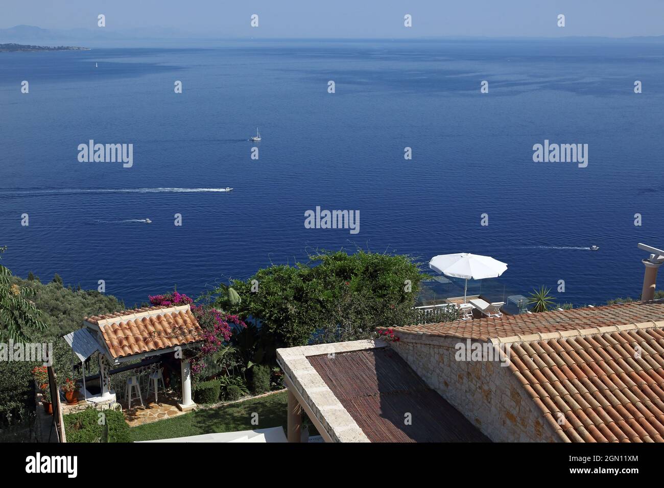 Holiday house above Nissaki Beach on the northeast coast of Corfu Island, Ionian Islands, Greece Stock Photo