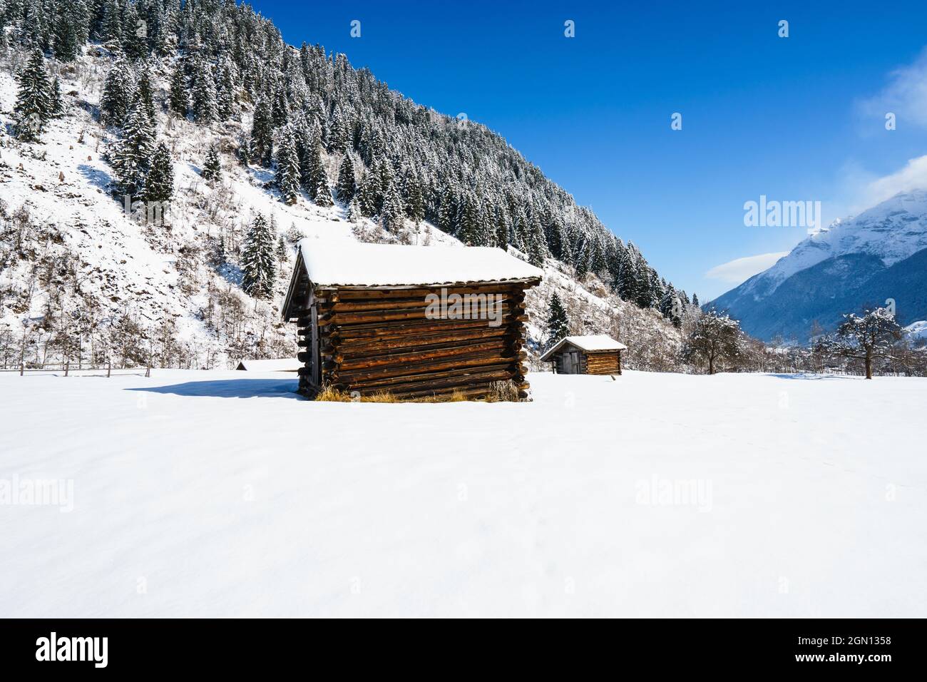 Abandoned old wooden houses covered with snow on a cold winter day in ...