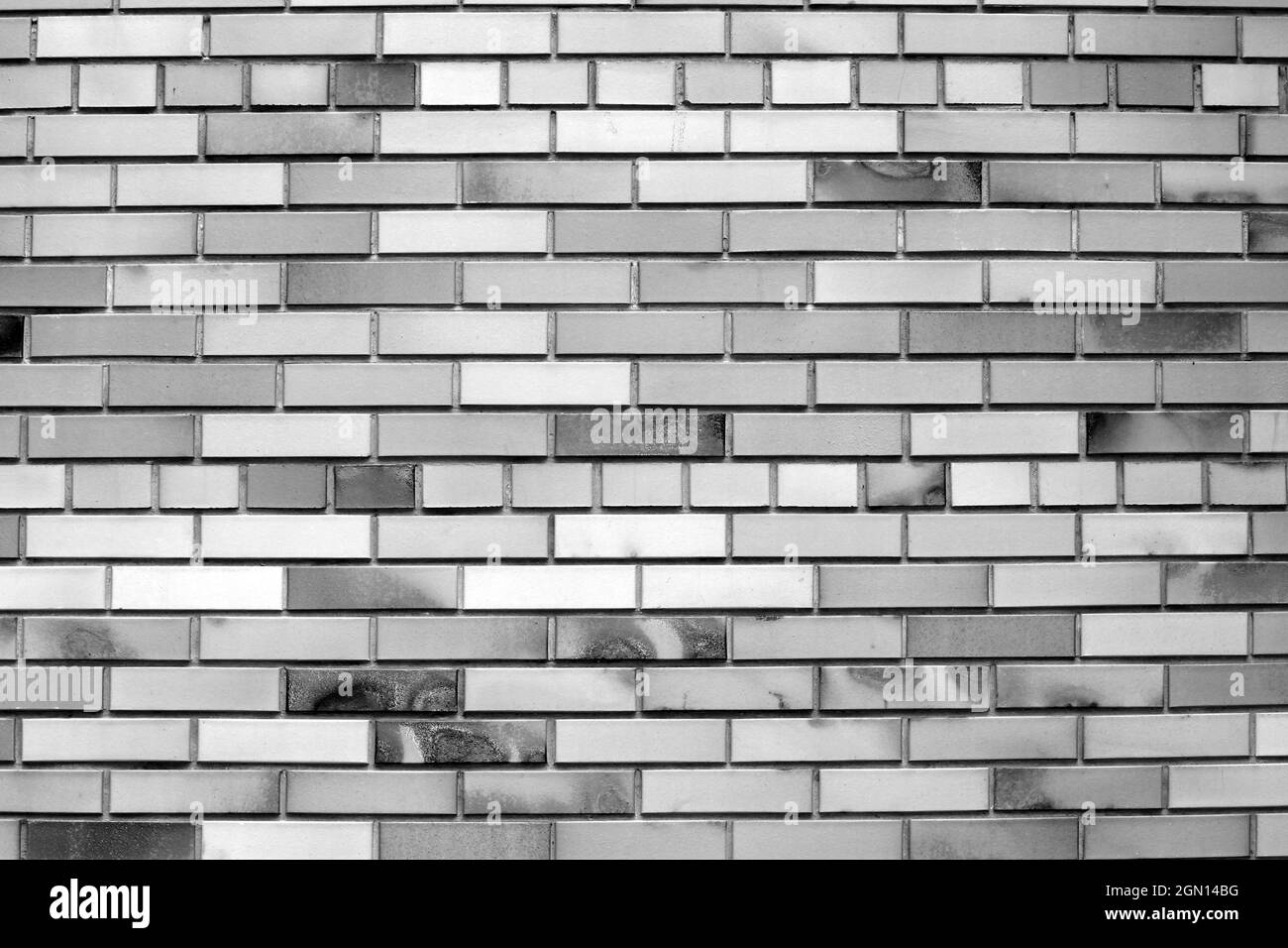Vintage black white brick wall background, diagonal position, stone