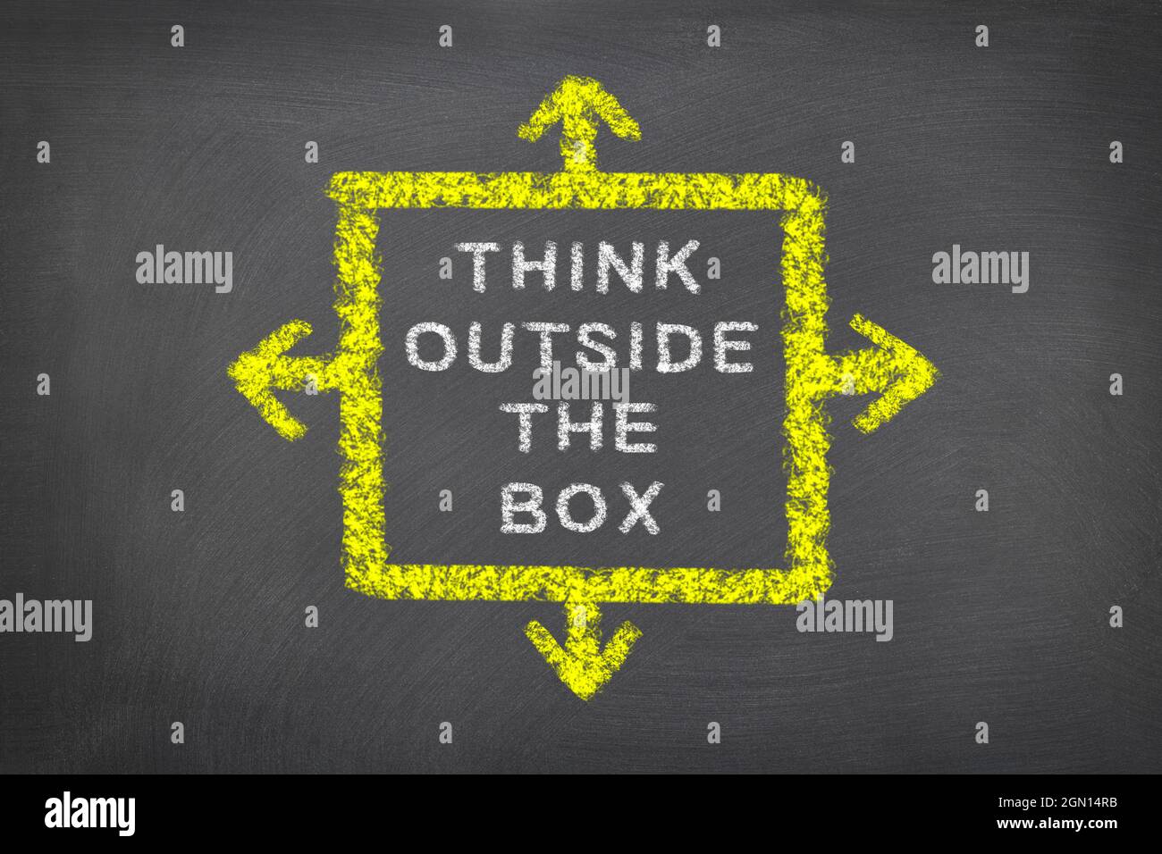 Chalkboard with think outside the box written on it and is intended to be used as messaging for creativity and breaking the status quo for businesses, Stock Photo