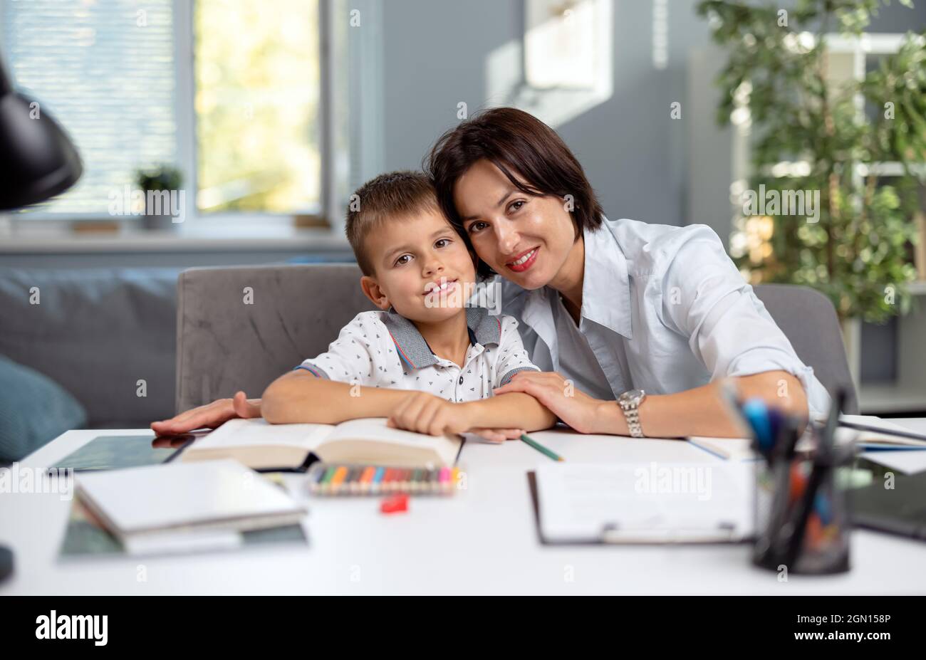 Mother teaching son Stock Photo - Alamy