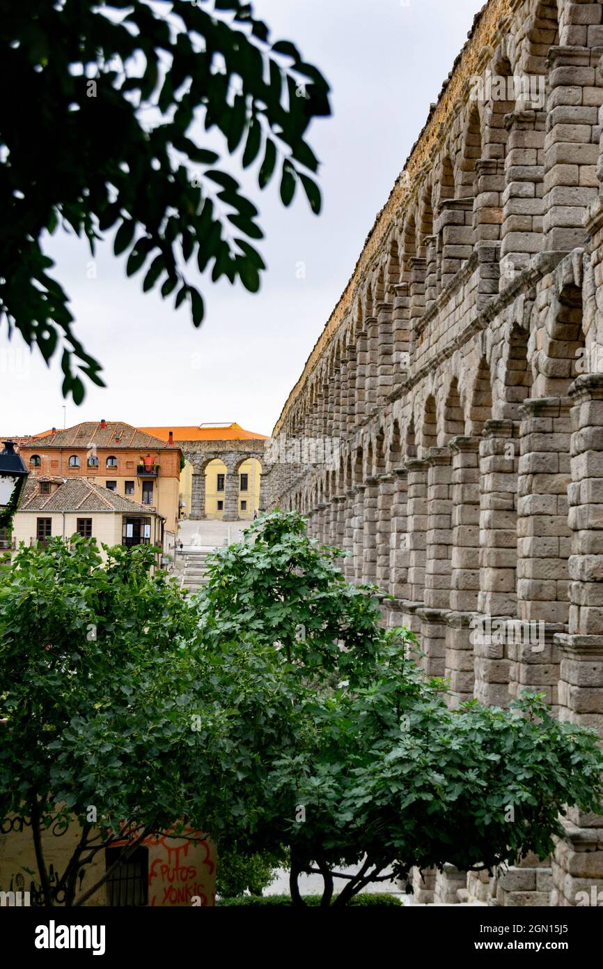 SEGOVIA SPAIN - SEPTEMBER 21, 2021. Aqueduct of Segovia. Ancient Roman aqueduct in the Plaza del Azoguejo and old construction cities in Segovia. Stock Photo