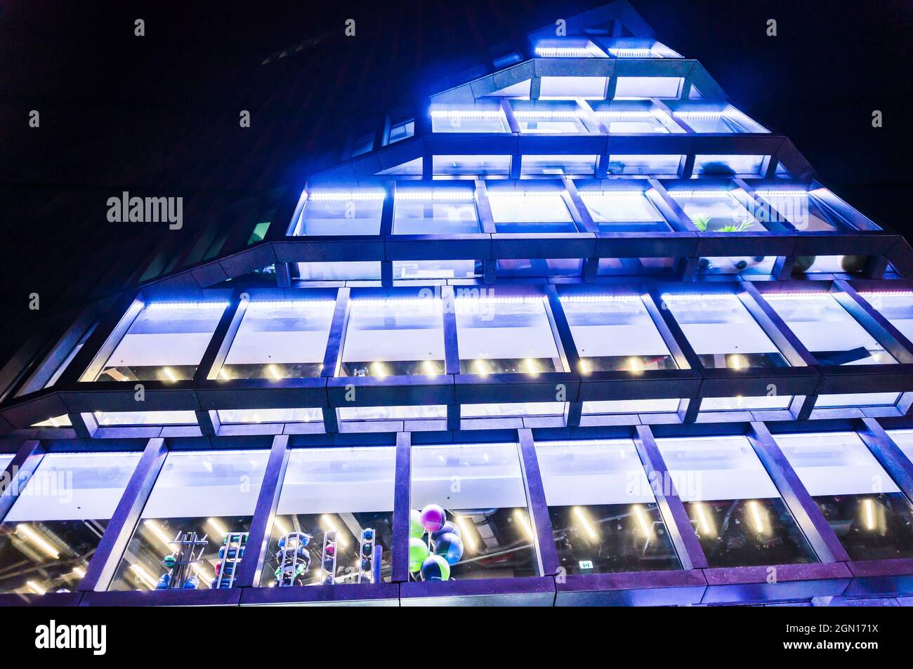 POZNAN, POLAND - Nov 01, 2018: A low angle shot of Baltyk office building by night located in Poznan, Poland Stock Photo