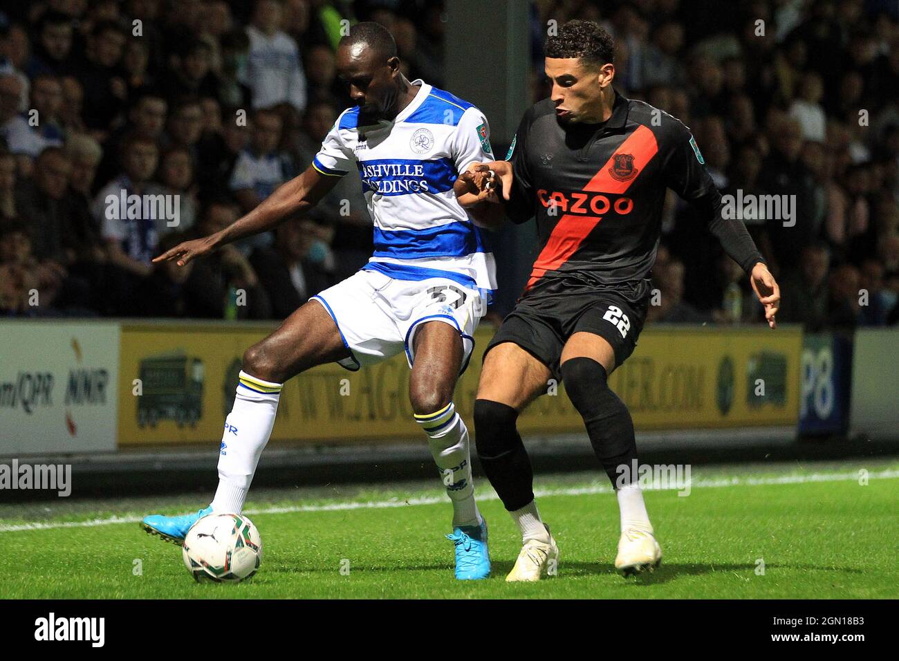 London, UK. 21st Sep, 2021. Albert Adomah of Queens Park Rangers (L) holds off Ben Godfrey of Everton (R). Carabao cup 3rd round match, Queens Park Rangers v Everton at The Kiyan Prince Foundation Stadium, Loftus Road in London on Tuesday 21st September 2021. this image may only be used for Editorial purposes. Editorial use only, license required for commercial use. No use in betting, games or a single club/league/player publications. pic by Steffan Bowen/Andrew Orchard sports photography/Alamy Live news Credit: Andrew Orchard sports photography/Alamy Live News Stock Photo
