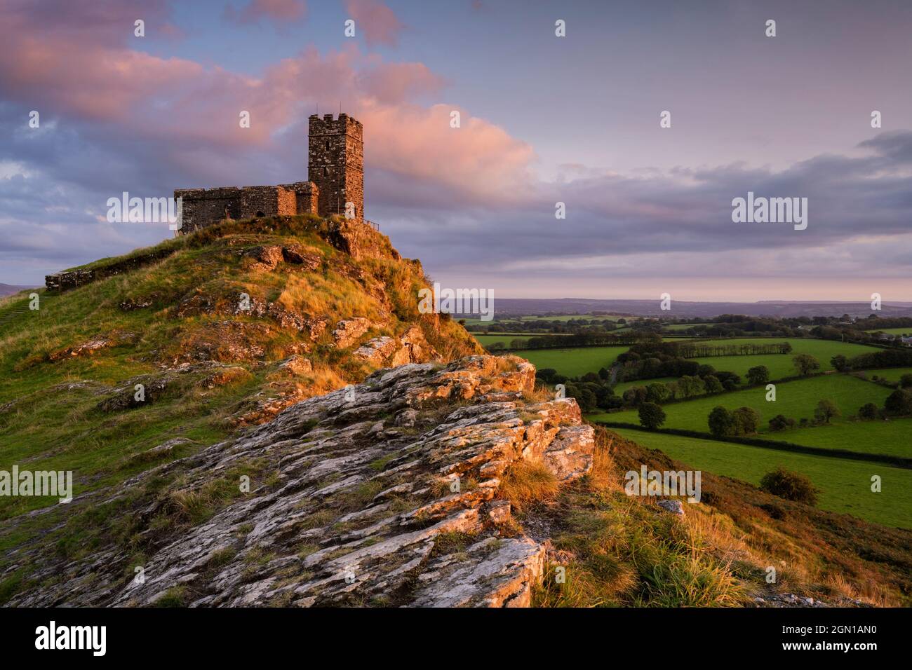 Brent Tor; Dartmoor National Park, Devon, UK. 21st Sep, 2021. UK Weather: St Michael de Rupe Church and Brent Tor, glow with golden evening colour as the sun sets over the beautiful West Devon Landscape. Credit: Celia McMahon/Alamy Live News Stock Photo