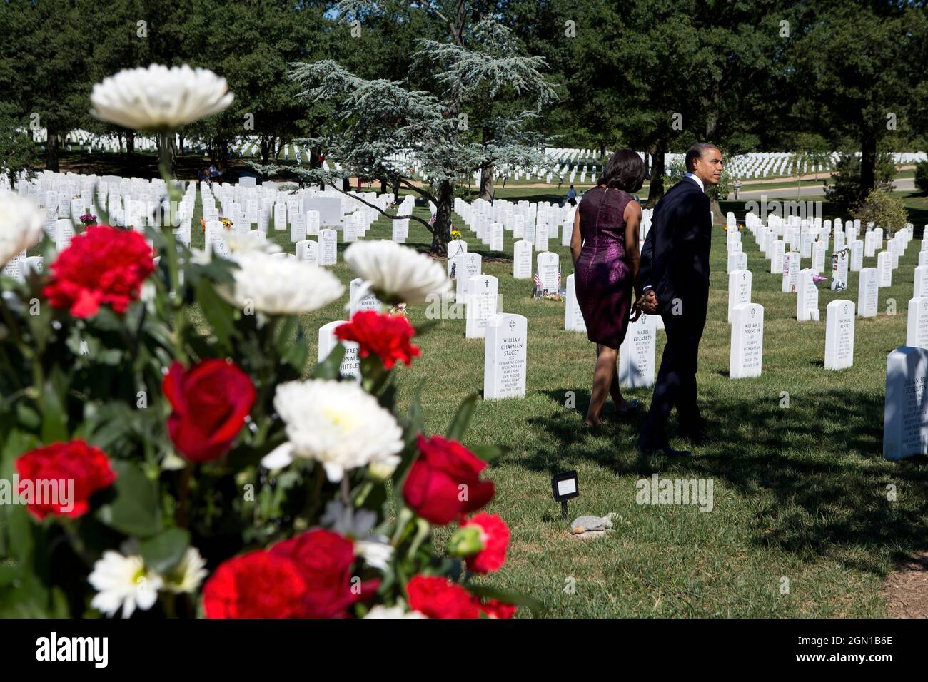 President Barack Obama and First Lady Michelle Obama visit Section 60 at Arlington National Cemetery in Arlington, Va., Sept. 11, 2012. (Official White House Photo by Pete Souza) This official White House photograph is being made available only for publication by news organizations and/or for personal use printing by the subject(s) of the photograph. The photograph may not be manipulated in any way and may not be used in commercial or political materials, advertisements, emails, products, promotions that in any way suggests approval or endorsement of the President, the First Family, or the Whi Stock Photo