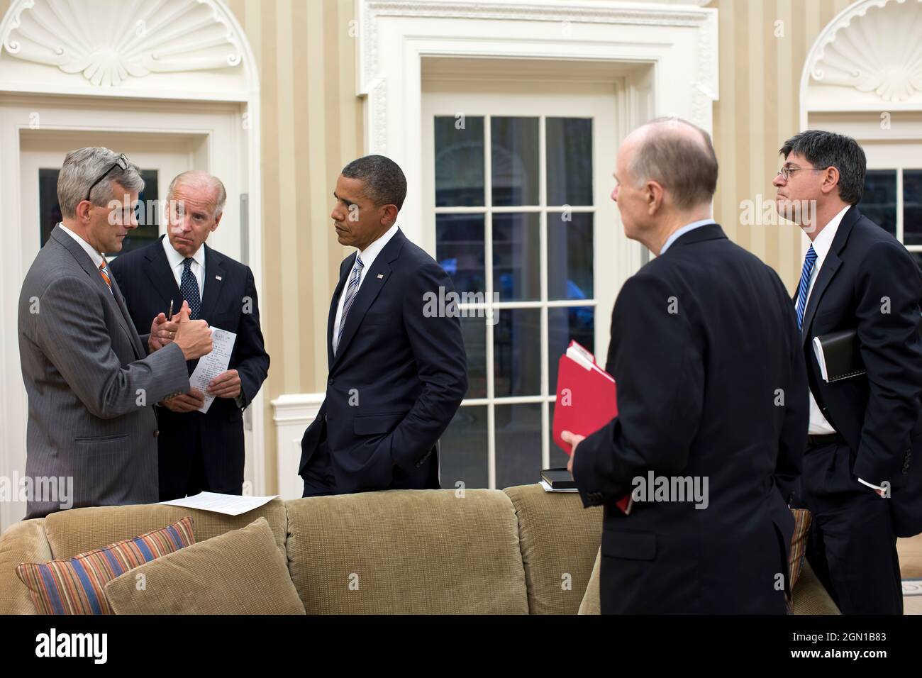 President Barack Obama and Vice President Joe Biden talk with senior advisors in the Oval Office, Sept. 11, 2012. Pictured, from left, are: Deputy National Security Advisor Denis McDonough; National Security Advisor Tom Donilon; and Chief of Staff Jack Lew. (Official White House Photo by Pete Souza) This official White House photograph is being made available only for publication by news organizations and/or for personal use printing by the subject(s) of the photograph. The photograph may not be manipulated in any way and may not be used in commercial or political materials, advertisements, em Stock Photo