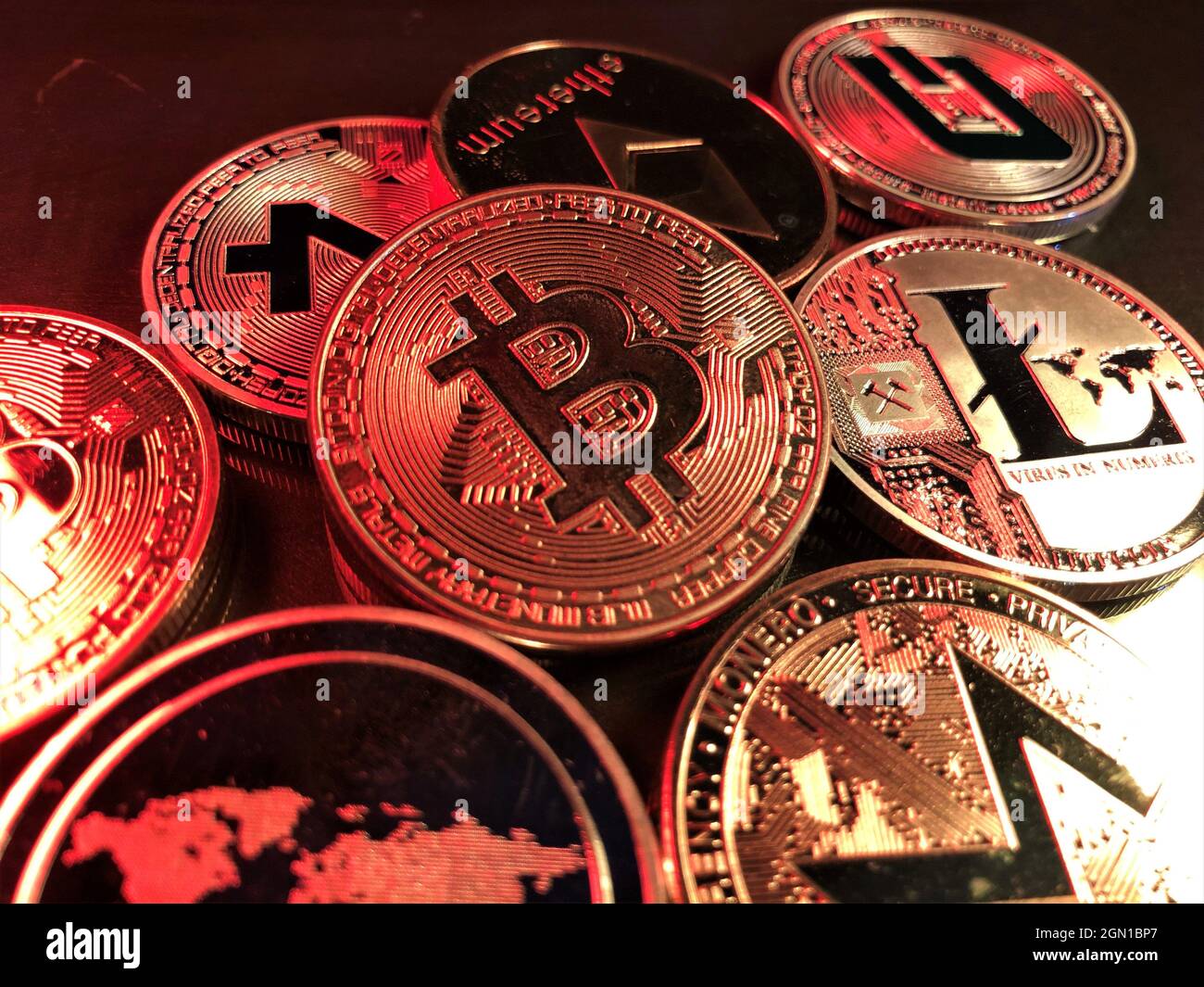 A pile of cryptocurrency coins. A digital asset designed to work as a medium of exchange that uses strong cryptography to secure financial transaction Stock Photo