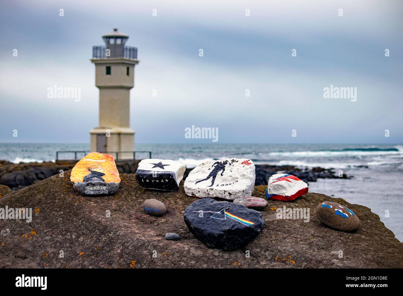 Painted Album Cover Rocks by the Sea, David Bowie and Pink Floyd, at Akranes Peninsula and Lighthouse in Iceland Stock Photo