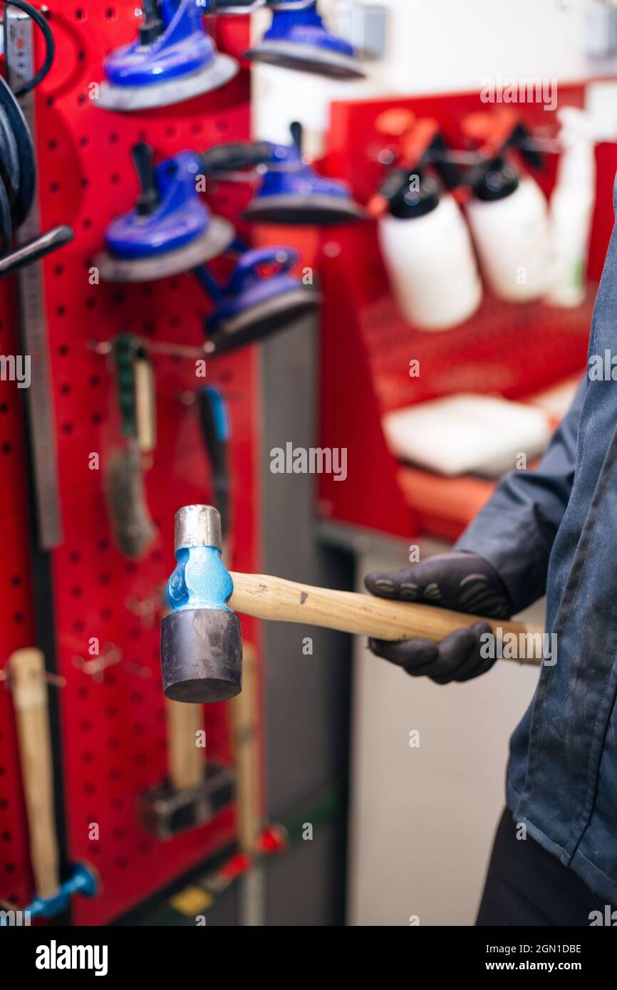 Auto mechanic peening car body surface with hammer Stock Photo Alamy