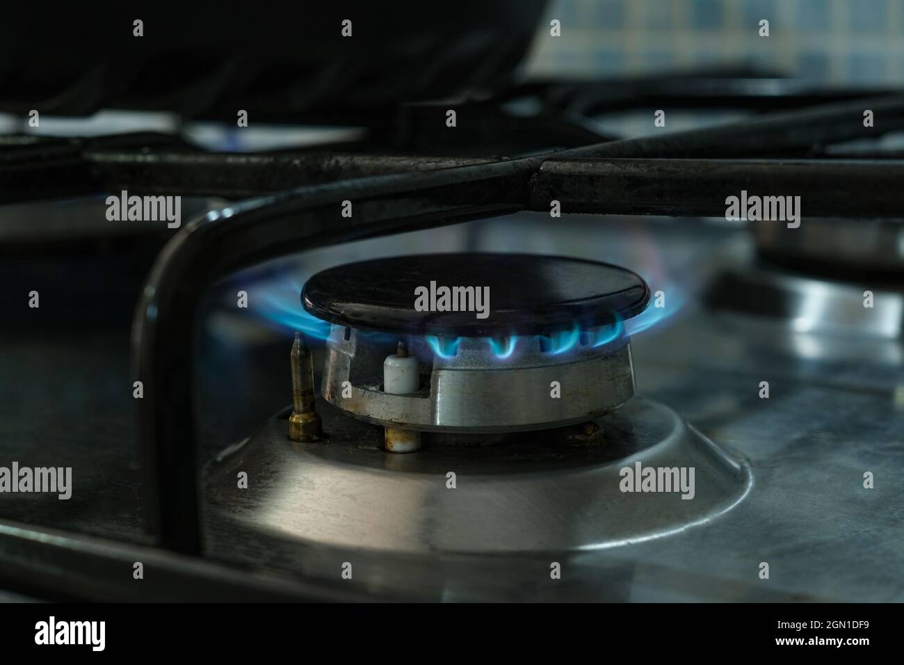 Lpg propane gas cooker close up while burning,not renewable energy wastage Stock Photo