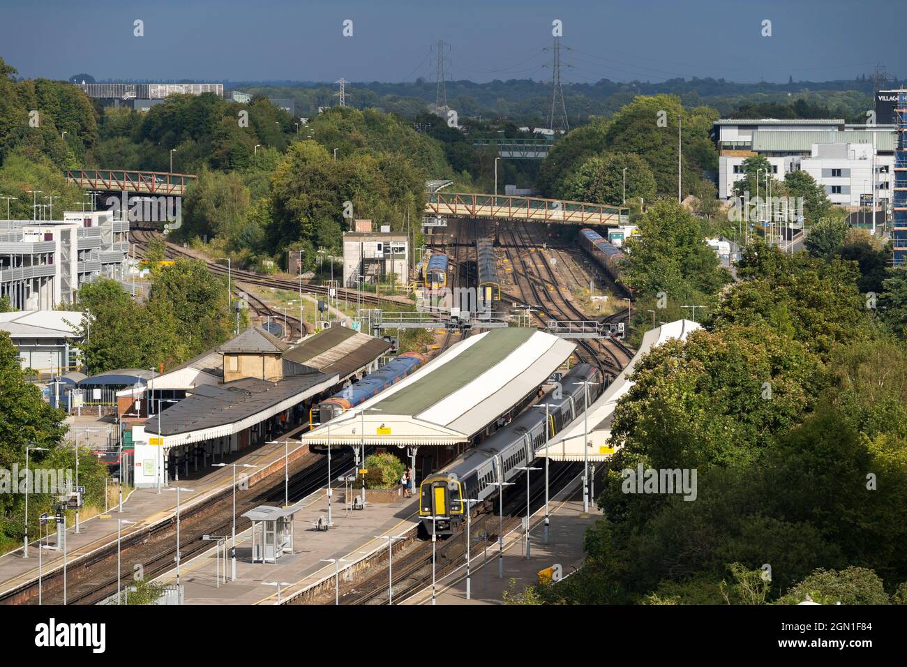 Aerial view during a sunny late summer September day looking down on Basingstoke railway station and South Western Railway trains. Hampshire, UK Stock Photo