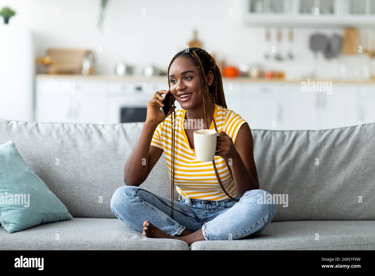Happy young black woman talking hi-res stock photography and images - Alamy