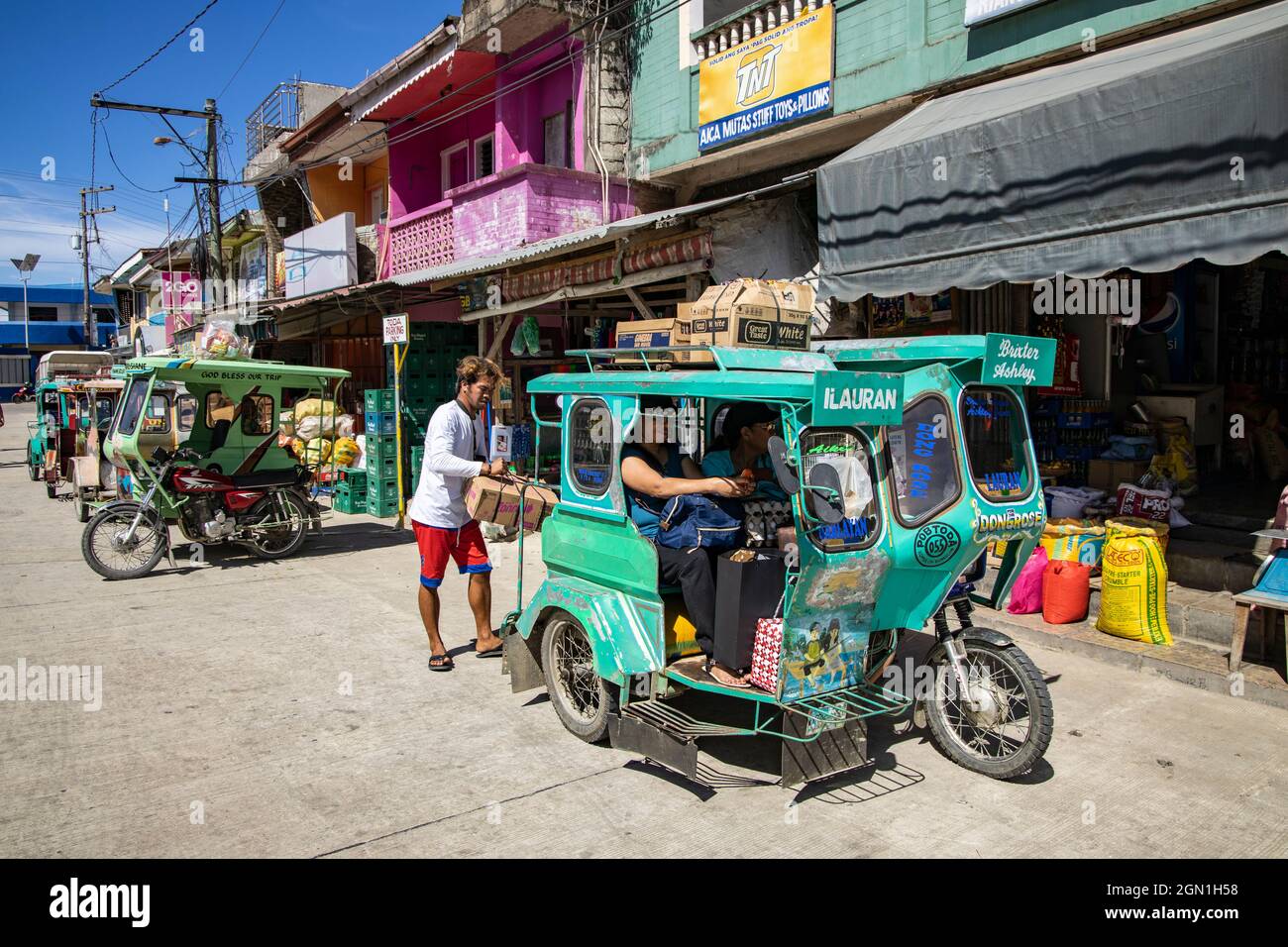 Shopping goods are loaded into a three-wheeled rickshaw in Romblon Town, Barangay I, Romblon, Romblon, Philippines, Asia Stock Photo