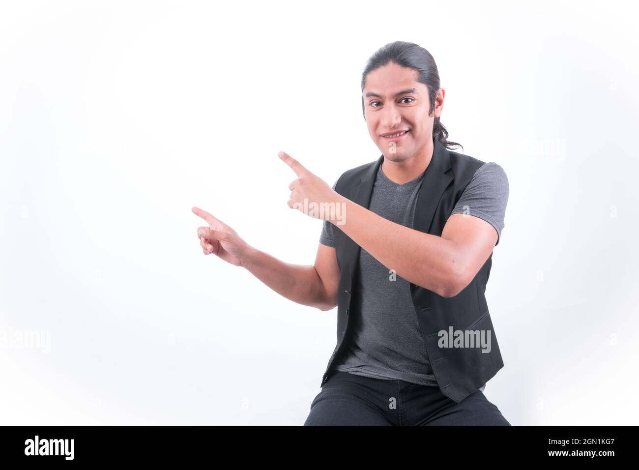 Person with white background, man gesturing, he points with both hands up showing the white area, blank space Stock Photo