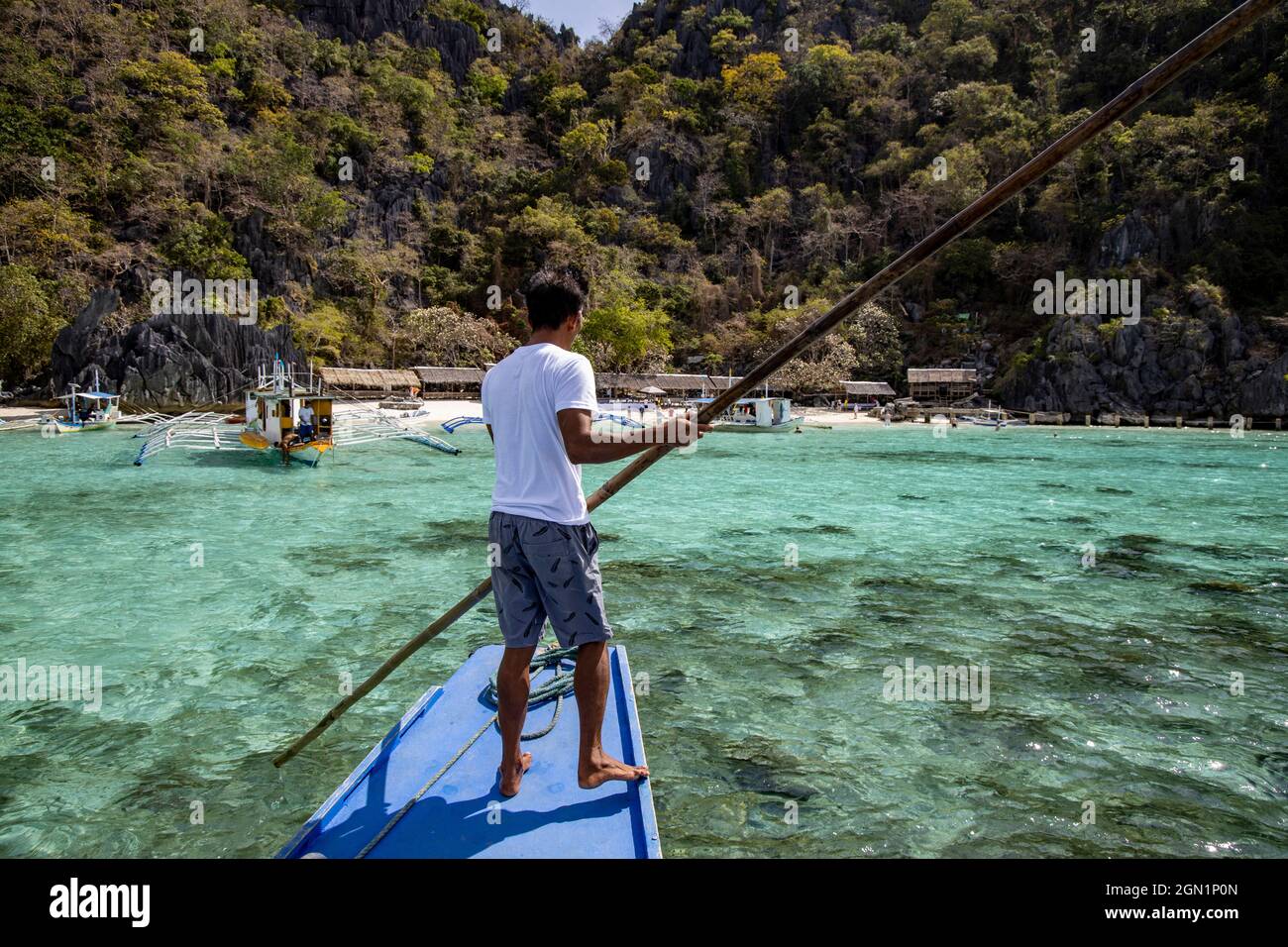 Boatswain on traditional Filipino Banca outrigger canoe at Dicantuman