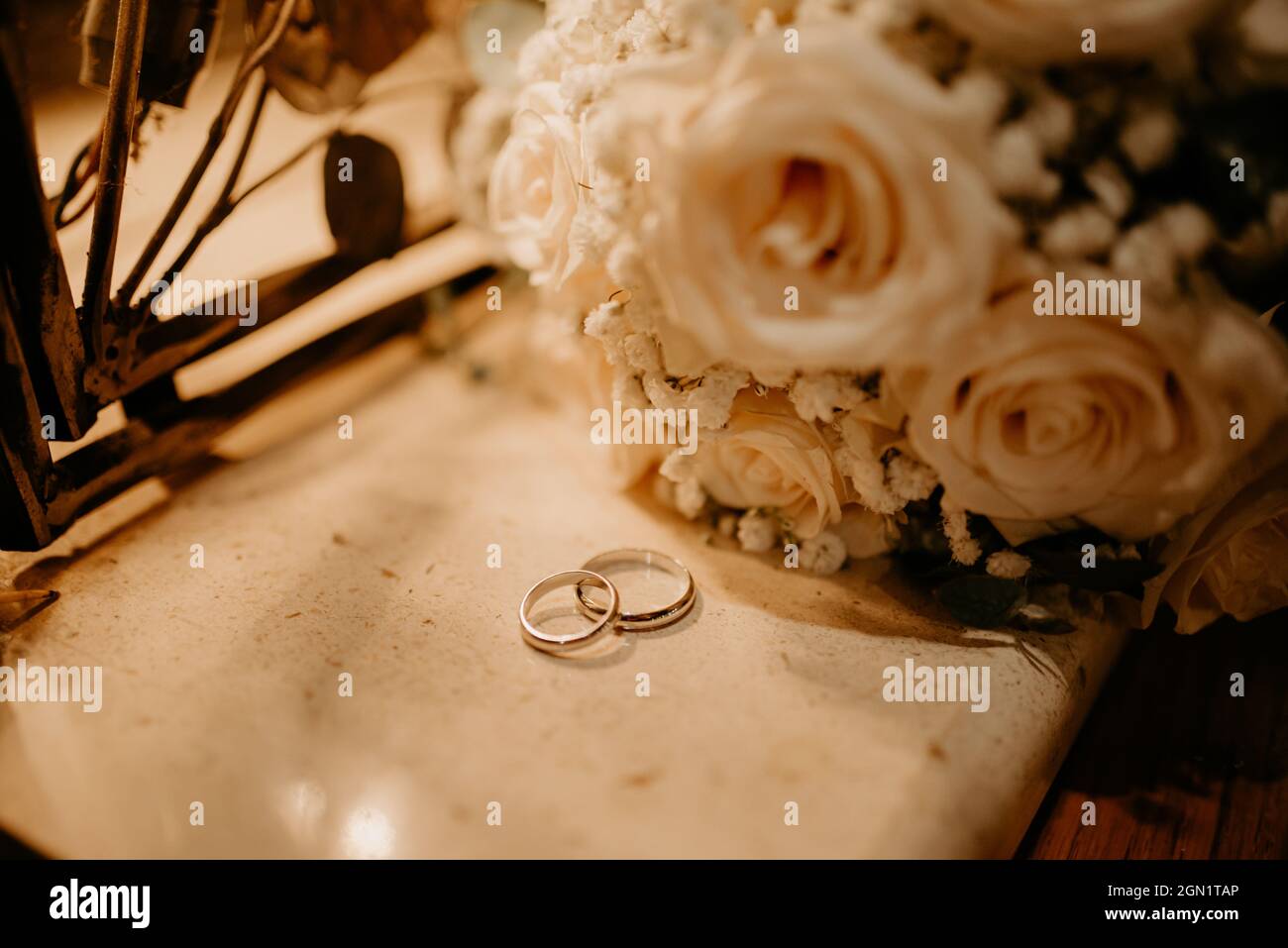 wedding rings and bouquet moody Stock Photo