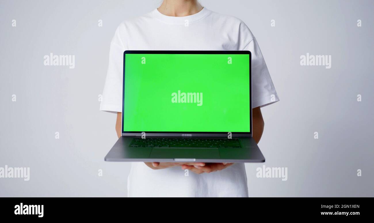 A laptop with a green screen Stock Photo