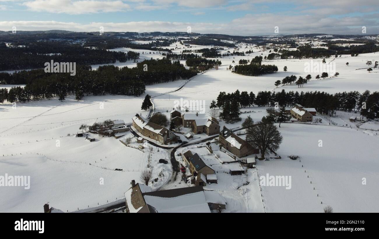 Aerial view of a snowy village houses and landscape fields Stock Photo ...