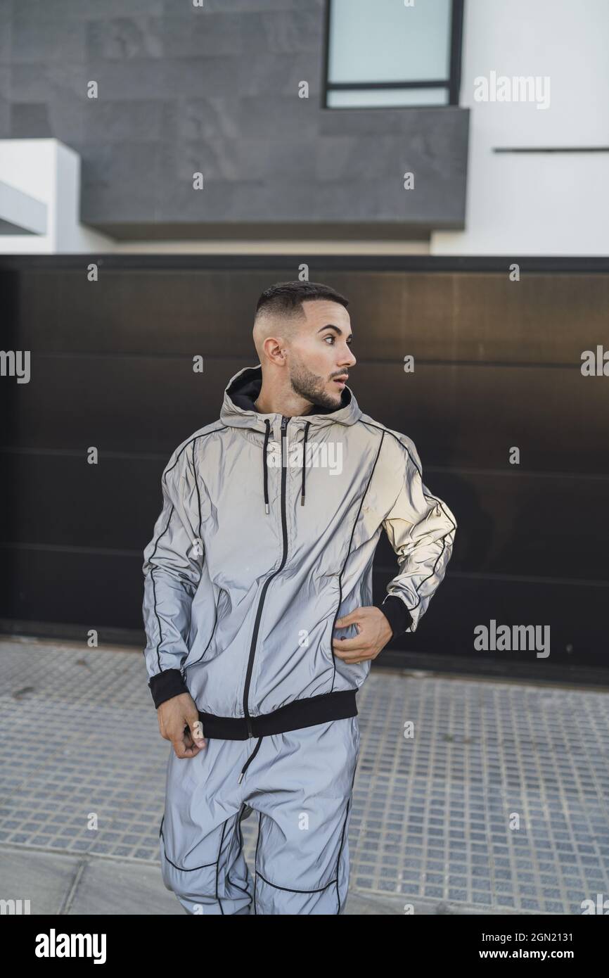 Handsome young Spanish male in a casual outfit posing outdoors Stock