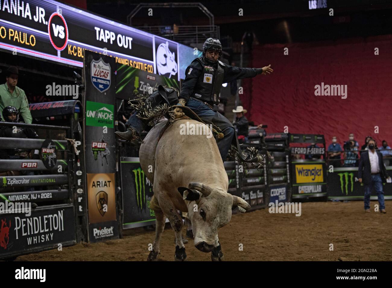 NEWARK, NJ - SEPTEMBER 19: Claudio Montanha Jr. rides Tapp Out during the Professional Bull Riders 2021 Unleash The Beast event at Prudential Center o Stock Photo