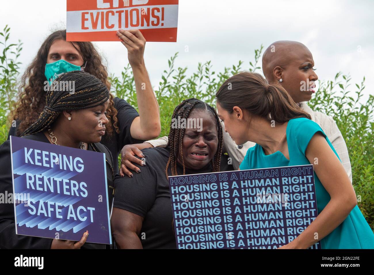 Vivian Smith, center, of Miami, Florida, cries while being comforted by