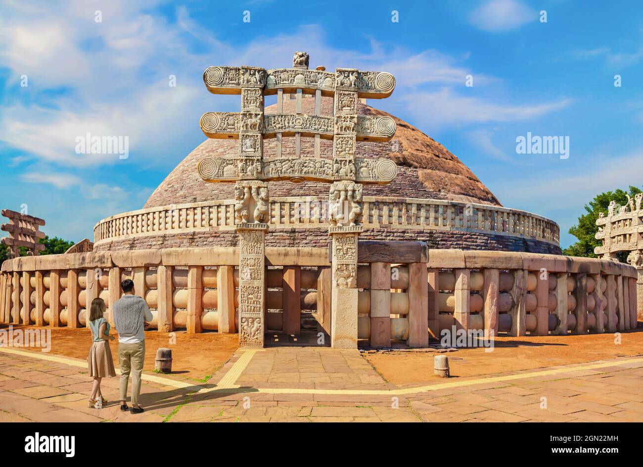 Tourist couple at Sanchi Stupa - a Buddhist stone structure located on a hilltop at Sanchi Town in Raisen District at Madhya Pradesh, India Stock Photo
