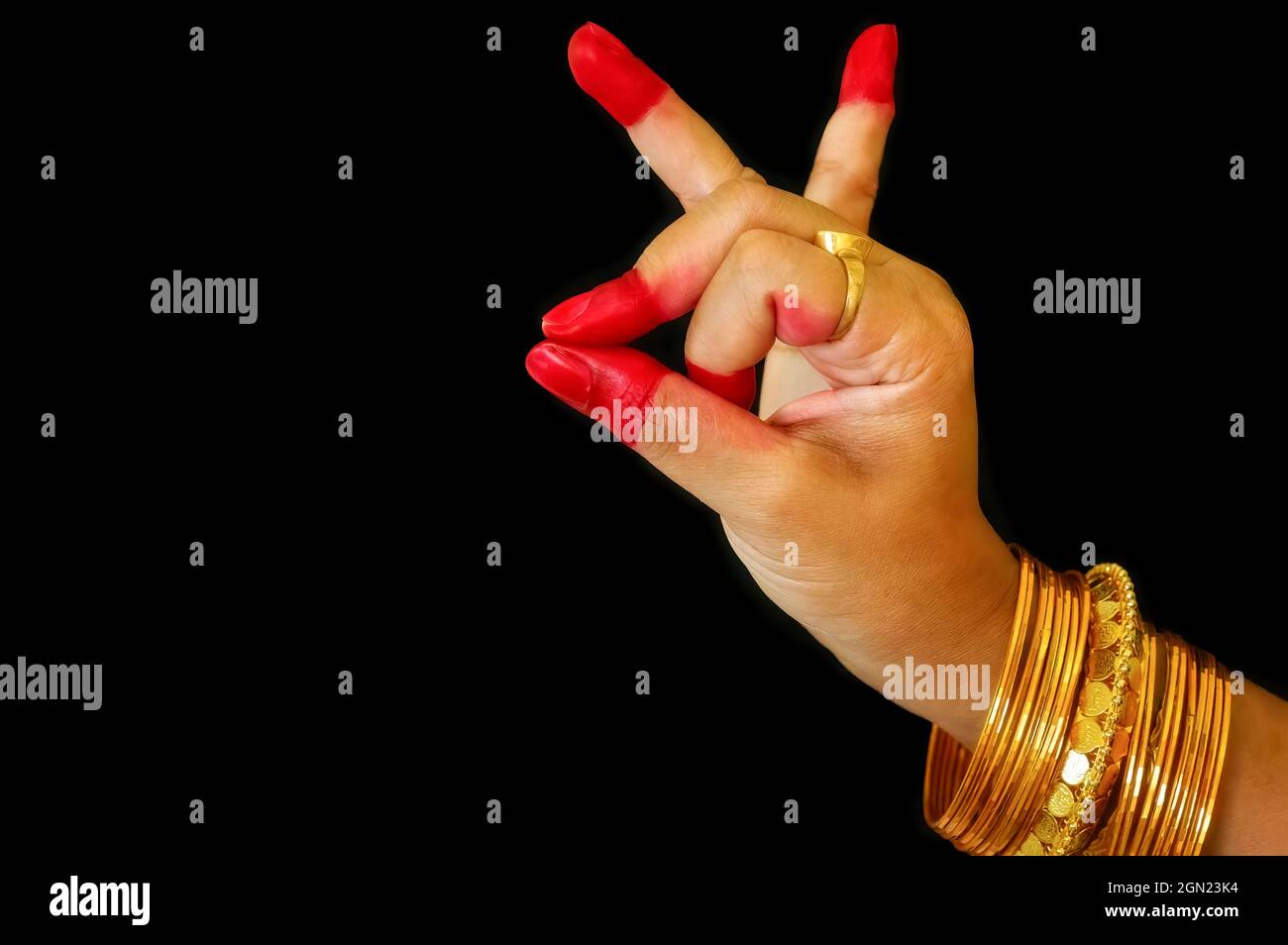 Woman classical dancer hands on black background showing 'Bhramara hasta' depicting a bee as a mudra of Indian Bharatanatyam dance Stock Photo