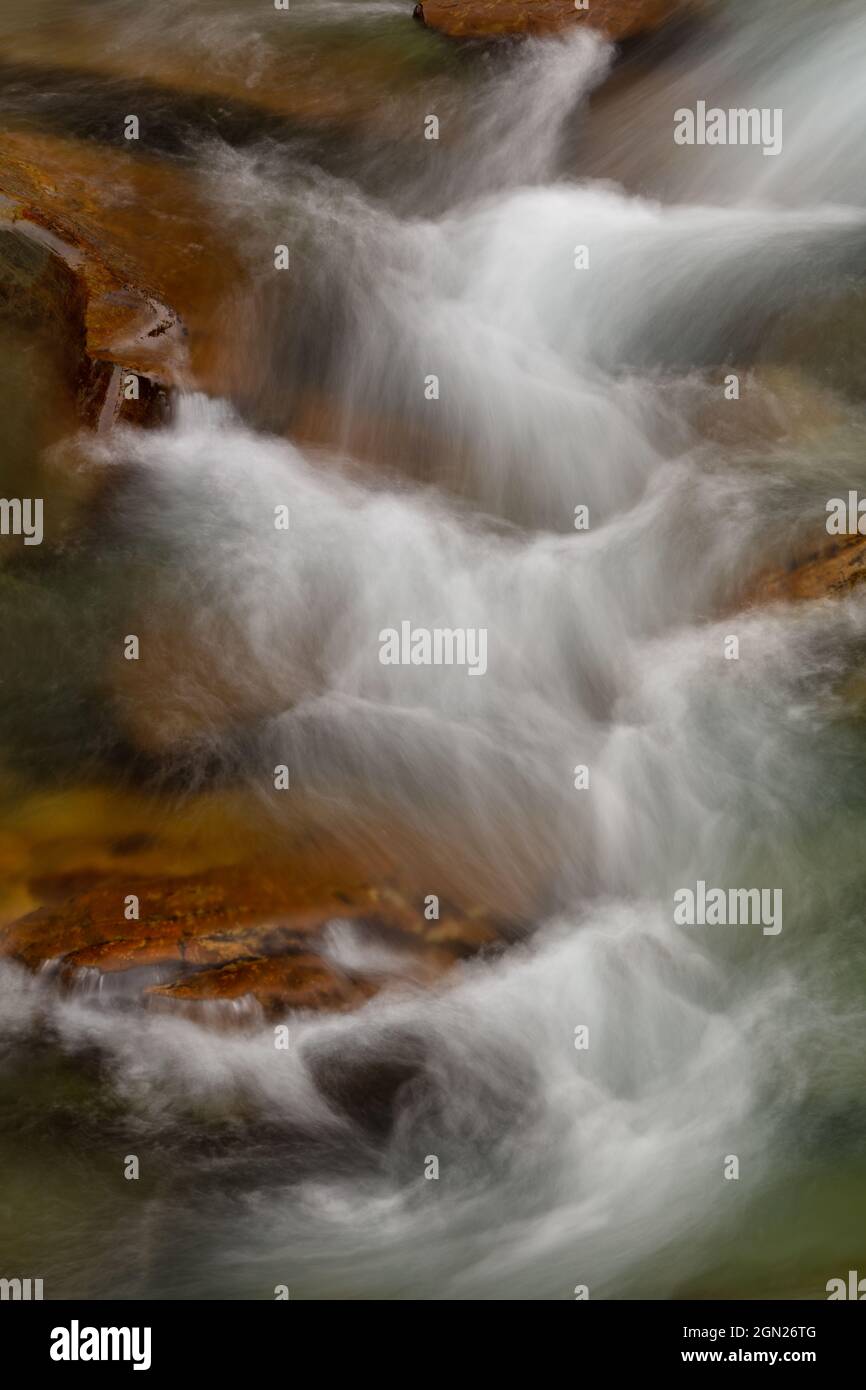 Water cascading down McDonald Creek, Glacier National Park, Montana Stock Photo