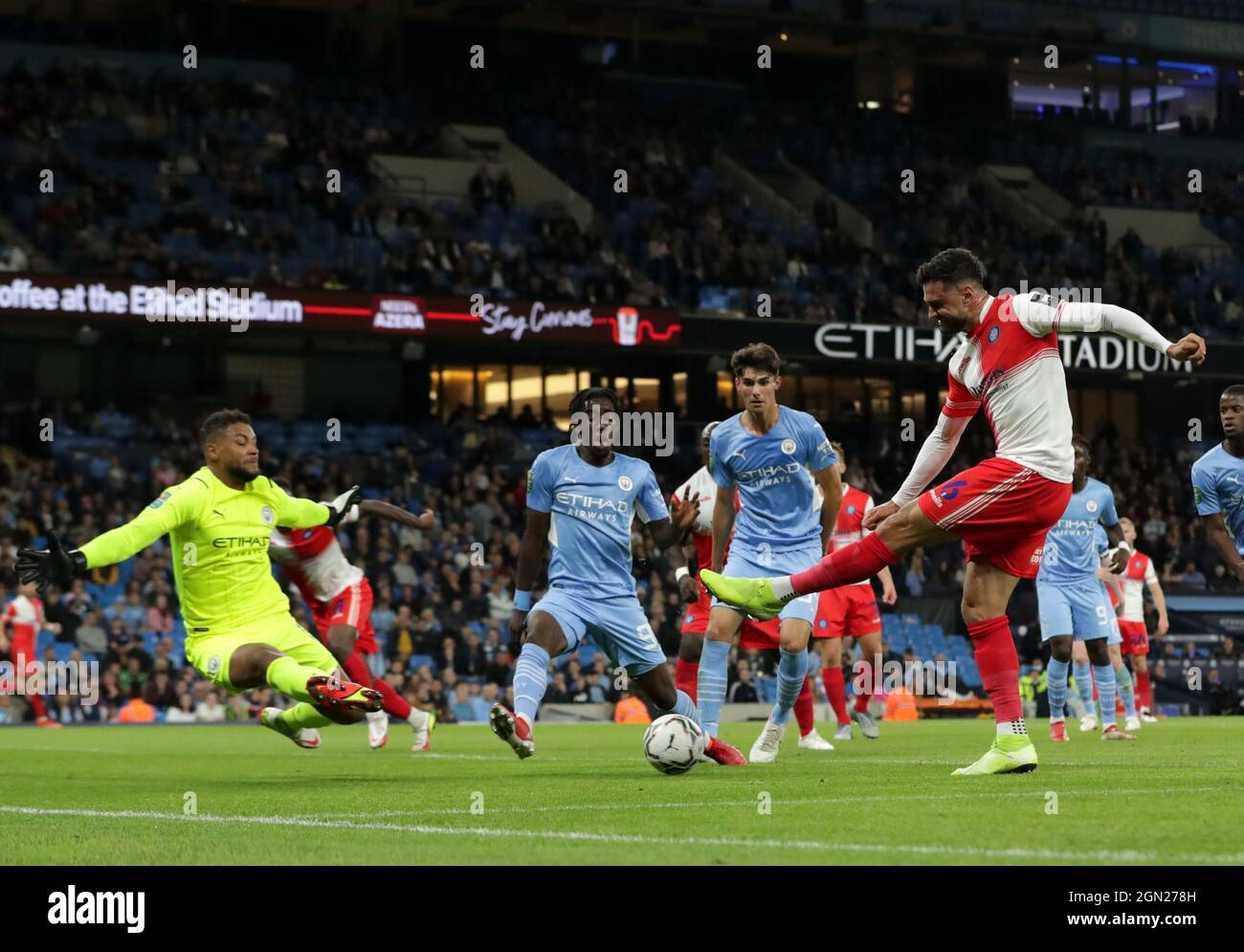 21st September 2021; Etihad Stadium,Manchester, England; EFL Cup Football Manchester City versus Wycombe Wanderers; Ryan Tafazolli of Wycombe Wanderers fires a shot across the Manchester City goalmouth Stock Photo