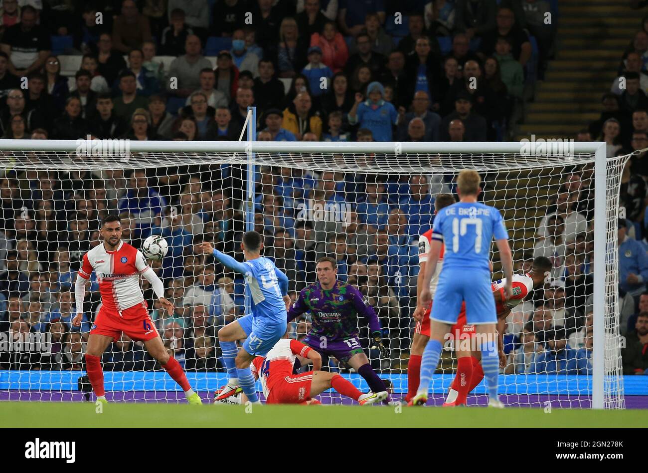 21st September 2021; Etihad Stadium,Manchester, England; EFL Cup Football Manchester City versus Wycombe Wanderers; Phil Foden of Manchester City sees his shot blocked by Ryan Tafazolli of Wycombe Wanderers Stock Photo